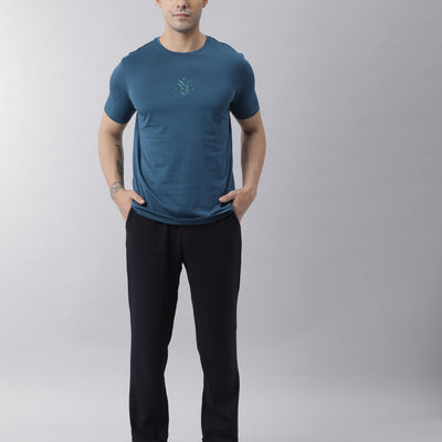 Rare Rabbit Men's Oval Petrol Cotton Fabric Crew Neck Half Sleeves Slim Fit Logo Detailing Solid T-Shirt