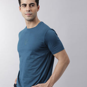Rare Rabbit Men's Oval Petrol Cotton Fabric Crew Neck Half Sleeves Slim Fit Logo Detailing Solid T-Shirt