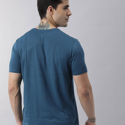 Rare Rabbit Men's Oval Petrol Cotton Fabric Crew Neck Half Sleeves Slim Fit Logo Detailing Solid T-Shirt