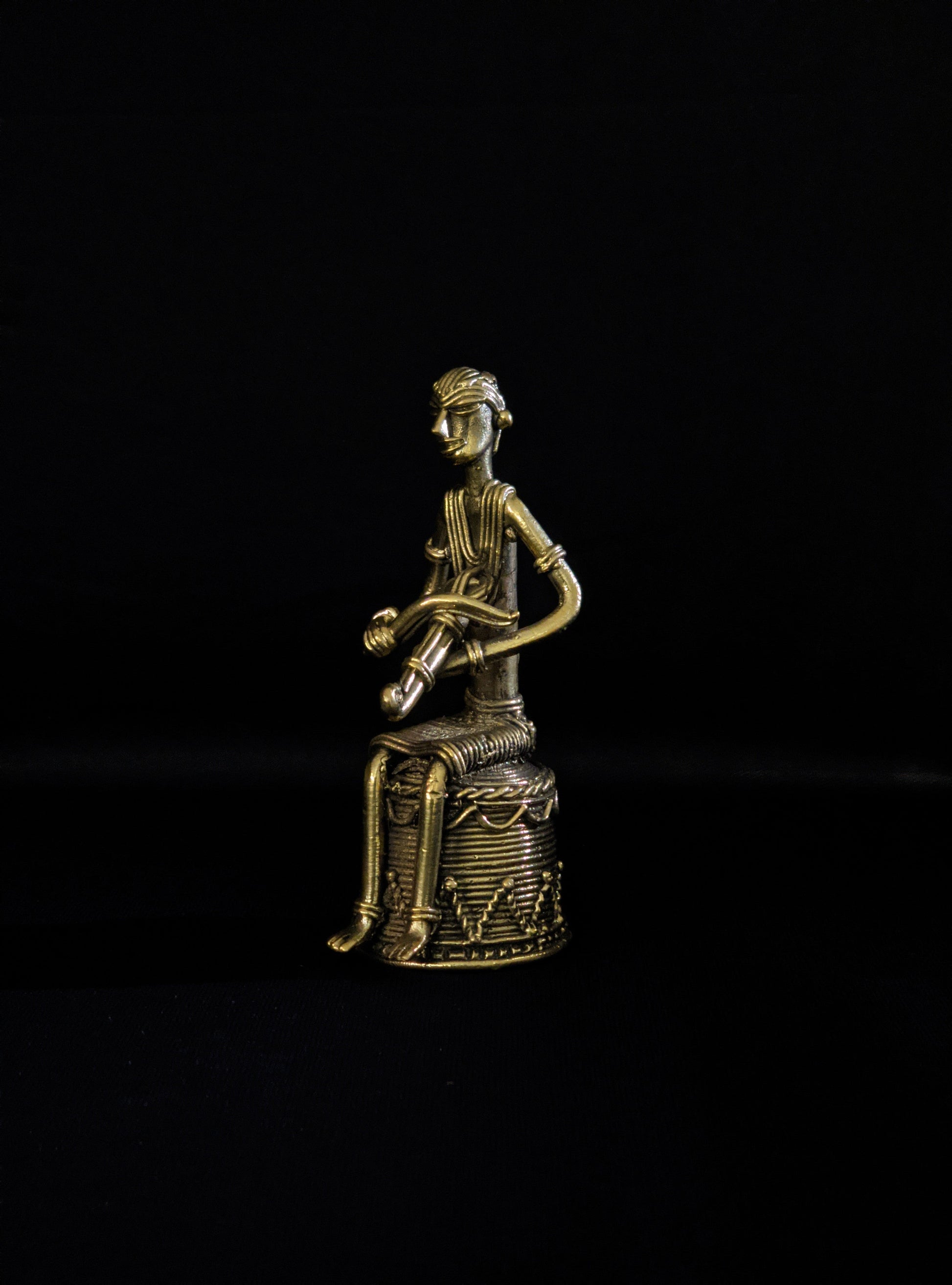 Dhokra - Tribal Musician sitting on base playing Kendra (1 PICES)