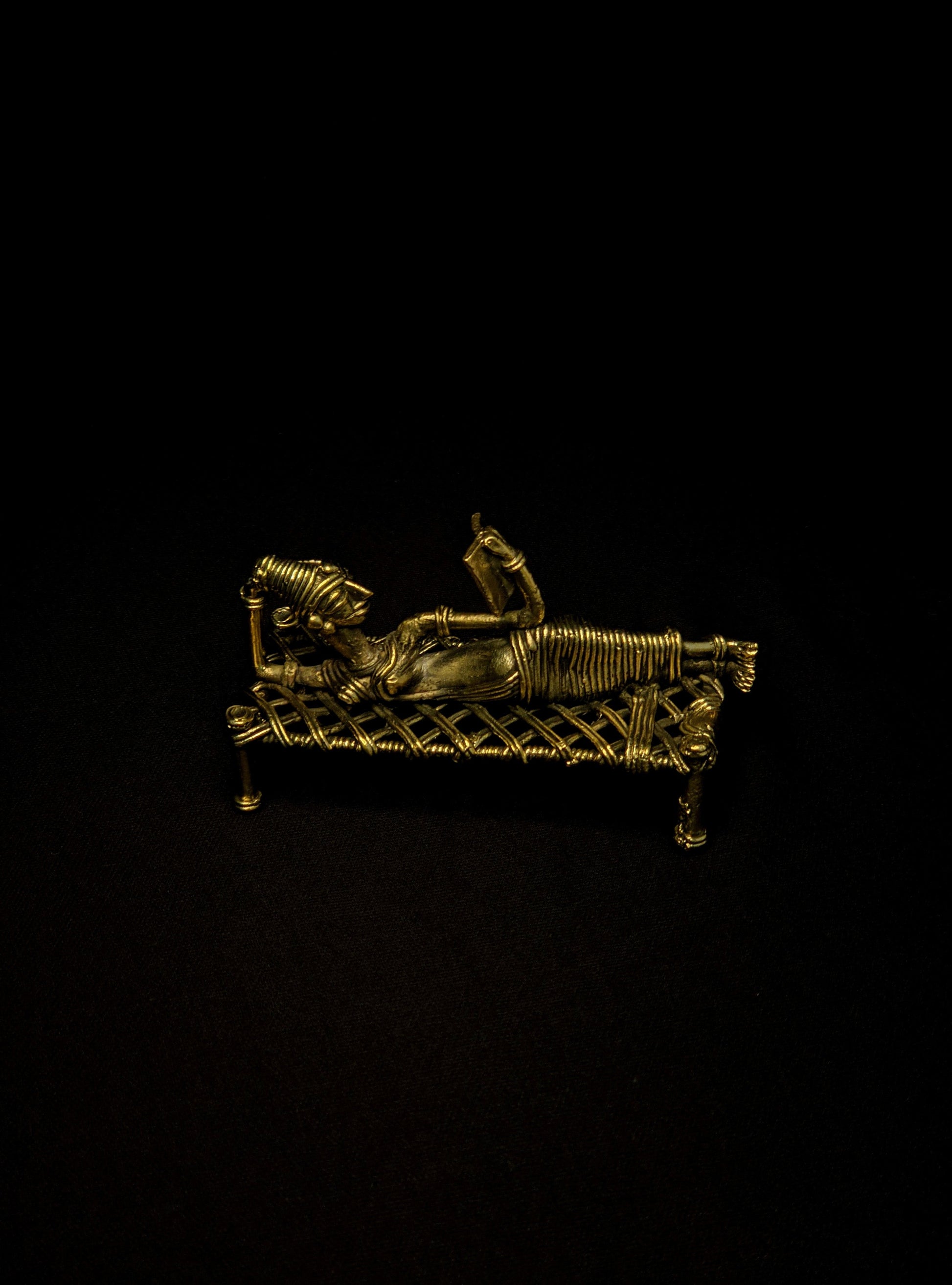 Dhokra - Tribal Lady Sleeping on Bed and Reading