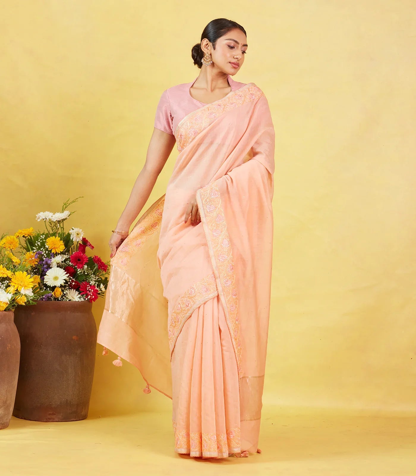 Peach Handwoven Linen Saree Embroidered With Floral Motifs