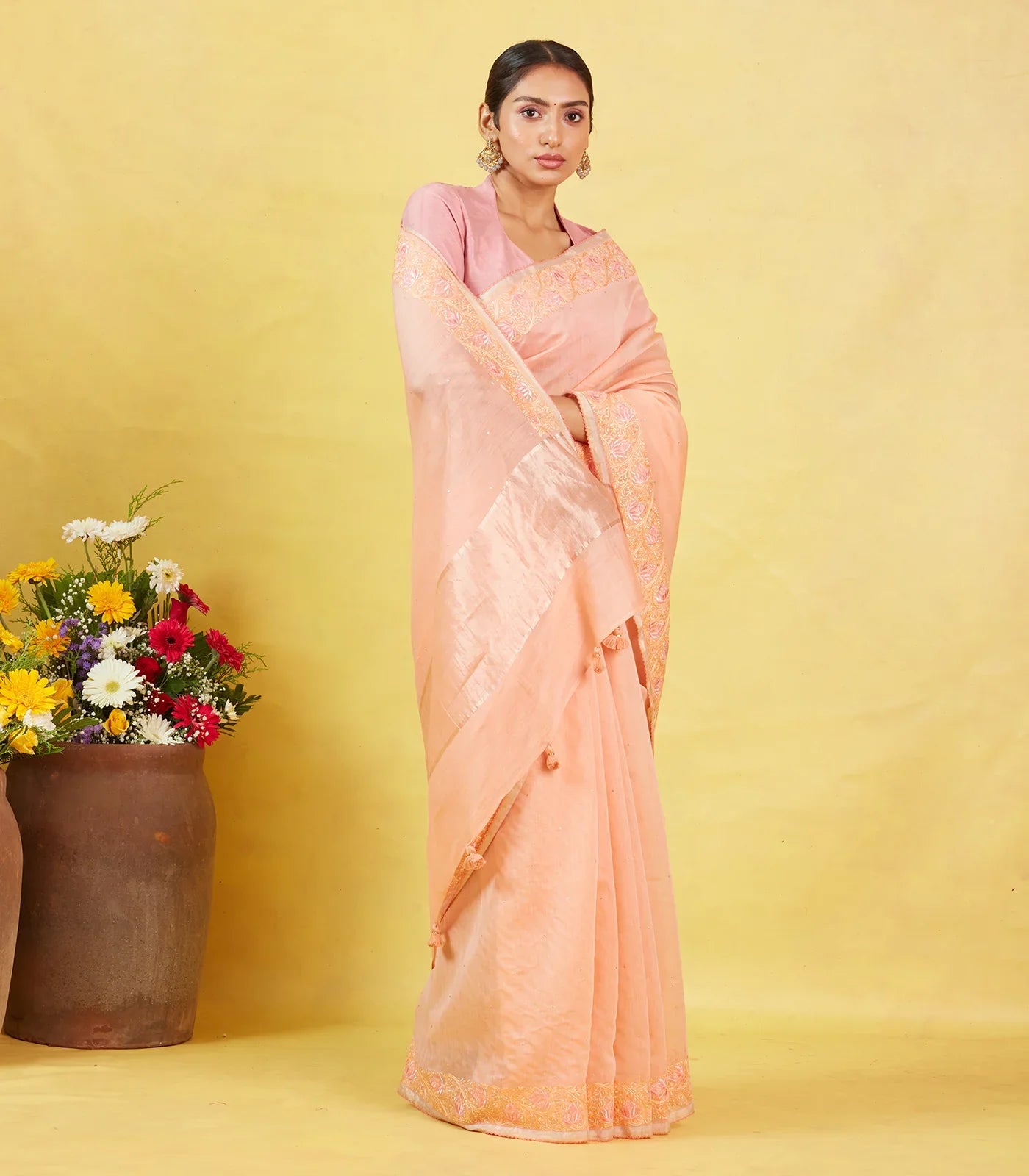 Peach Handwoven Linen Saree Embroidered With Floral Motifs