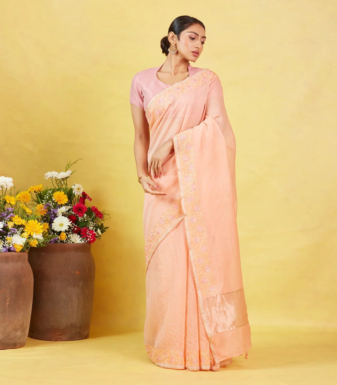 Peach Handwoven Linen Saree Embroidered With Floral Motifs