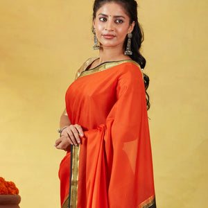 Orange Mysore Plain Crepe Silk Saree With Black Border