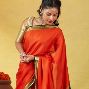 Orange Mysore Plain Crepe Silk Saree With Black Border