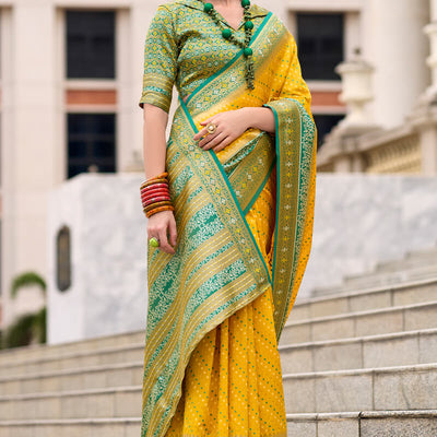 Ebullience Yellow Patola Silk Saree with Embrocation Blouse Piece