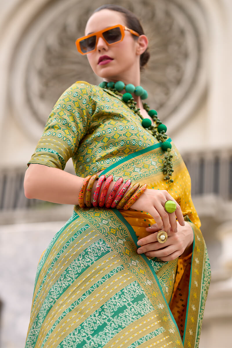 Ebullience Yellow Patola Silk Saree with Embrocation Blouse Piece