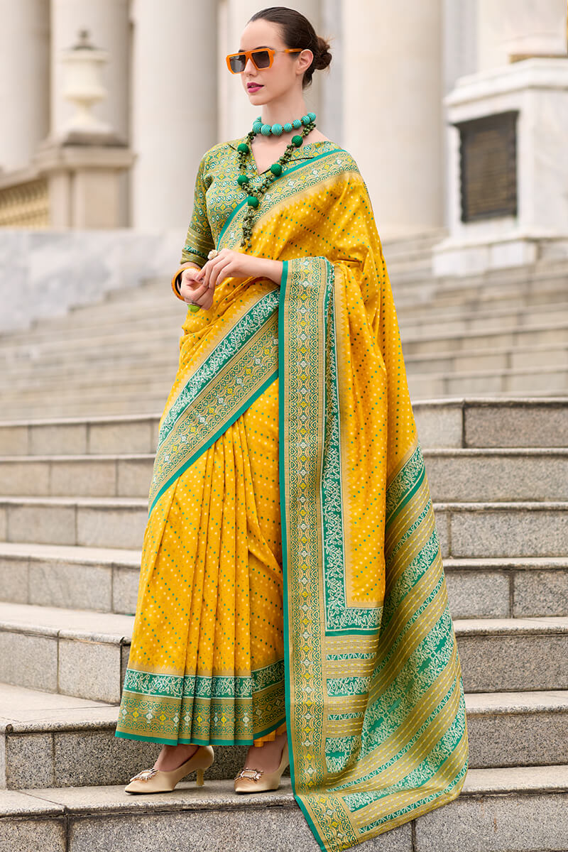 Ebullience Yellow Patola Silk Saree with Embrocation Blouse Piece