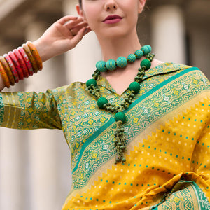 Ebullience Yellow Patola Silk Saree with Embrocation Blouse Piece