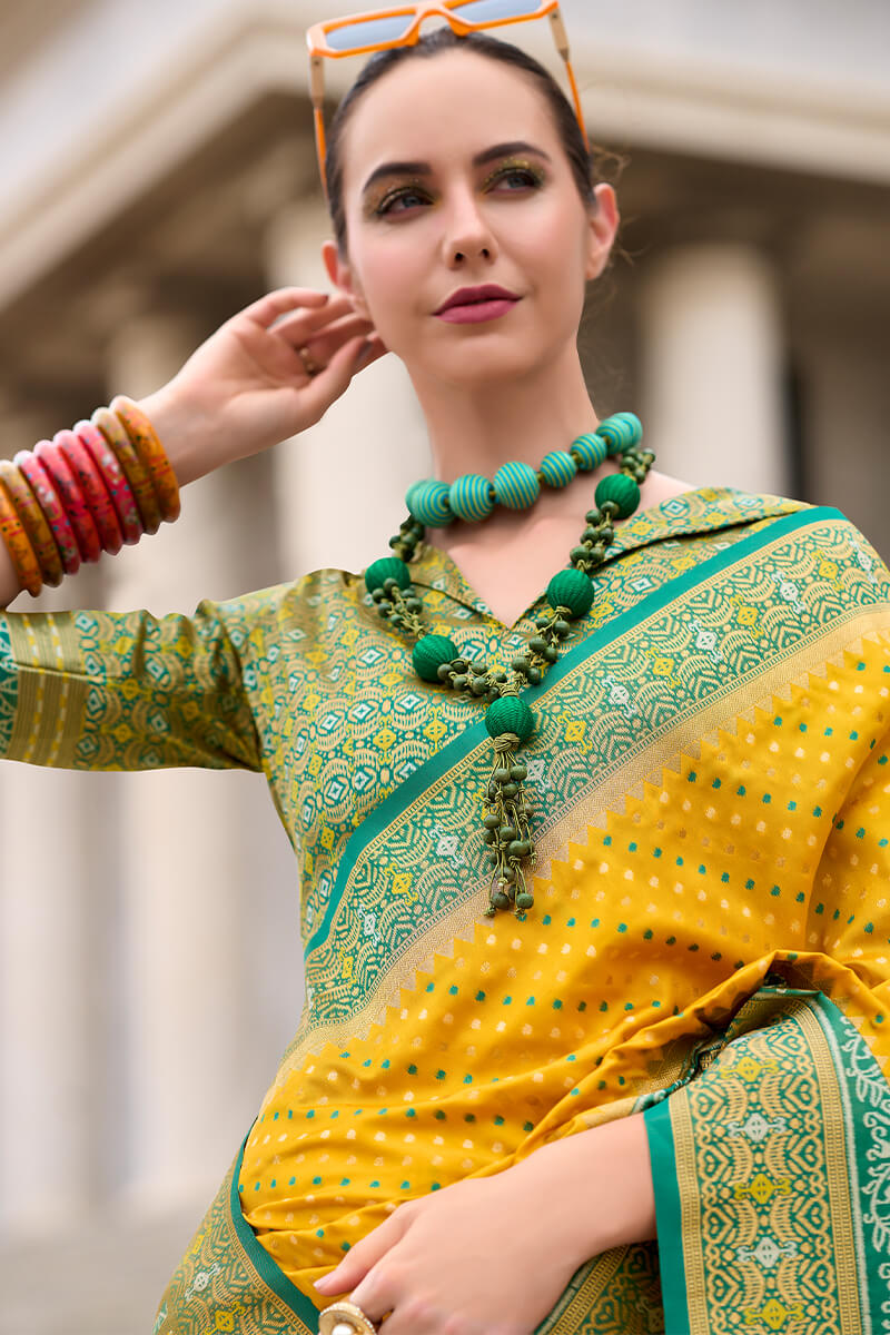 Ebullience Yellow Patola Silk Saree with Embrocation Blouse Piece