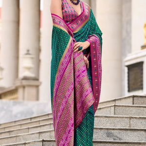 Twirling Dark Green Patola Silk Saree with Confounding Blouse Piece