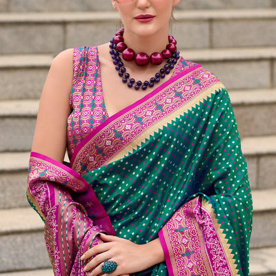Twirling Dark Green Patola Silk Saree with Confounding Blouse Piece