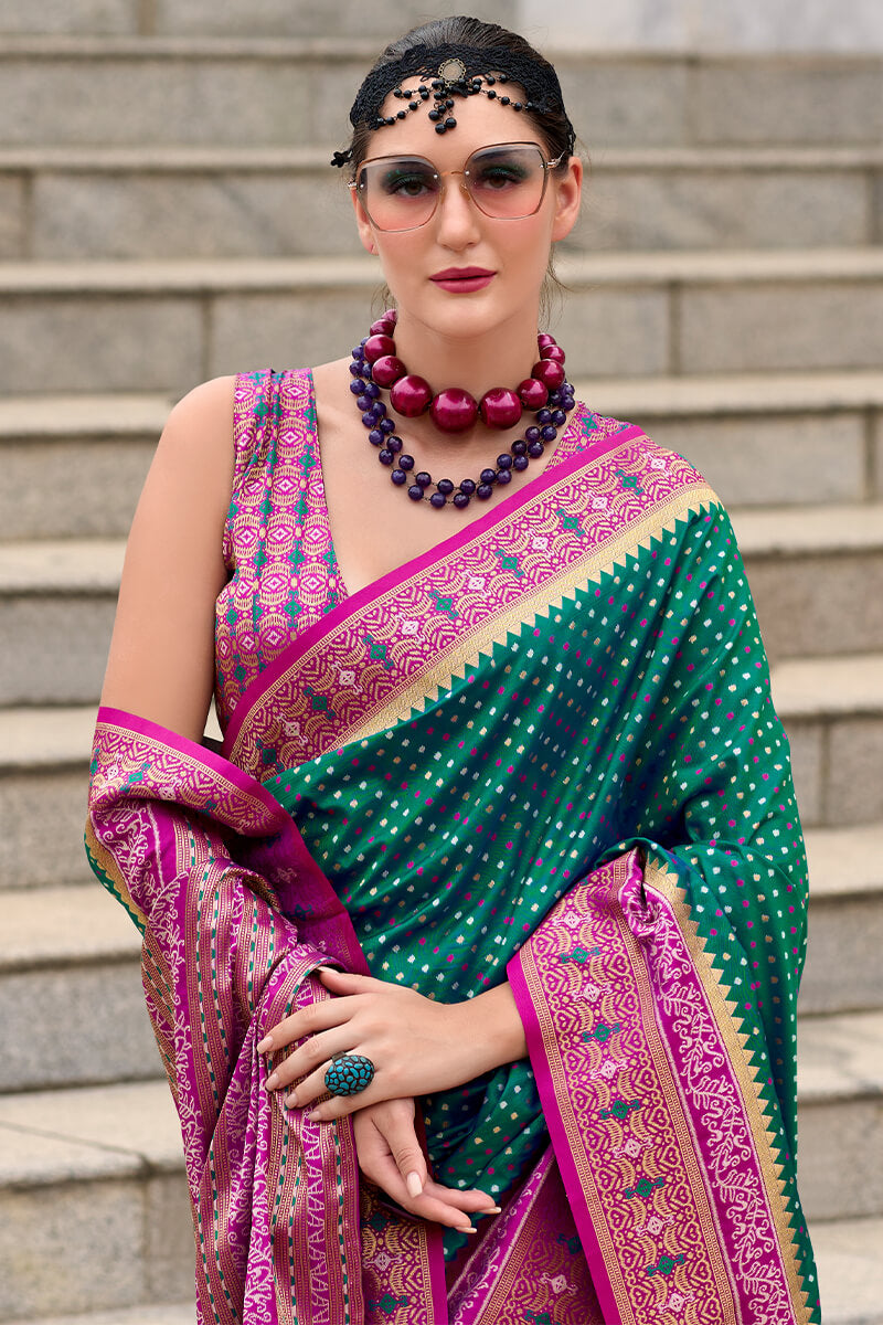 Twirling Dark Green Patola Silk Saree with Confounding Blouse Piece