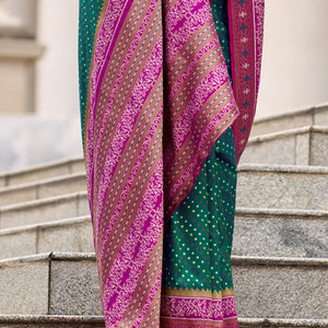Twirling Dark Green Patola Silk Saree with Confounding Blouse Piece
