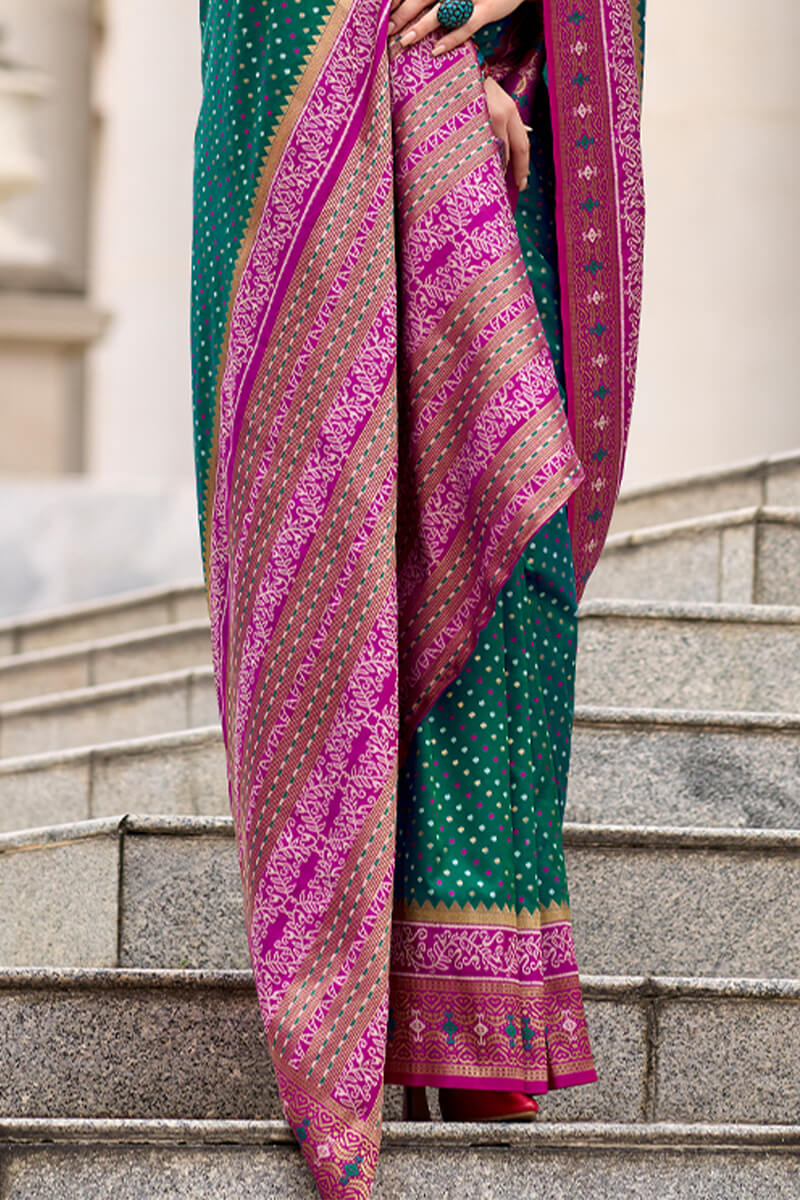 Twirling Dark Green Patola Silk Saree with Confounding Blouse Piece