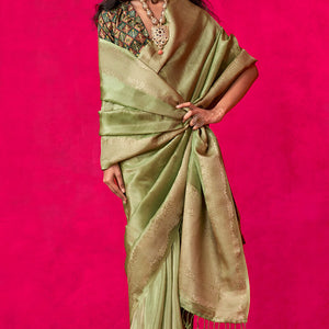 Resonant Green Soft Banarasi Tissue Silk Saree With Beauteous Blouse Piece