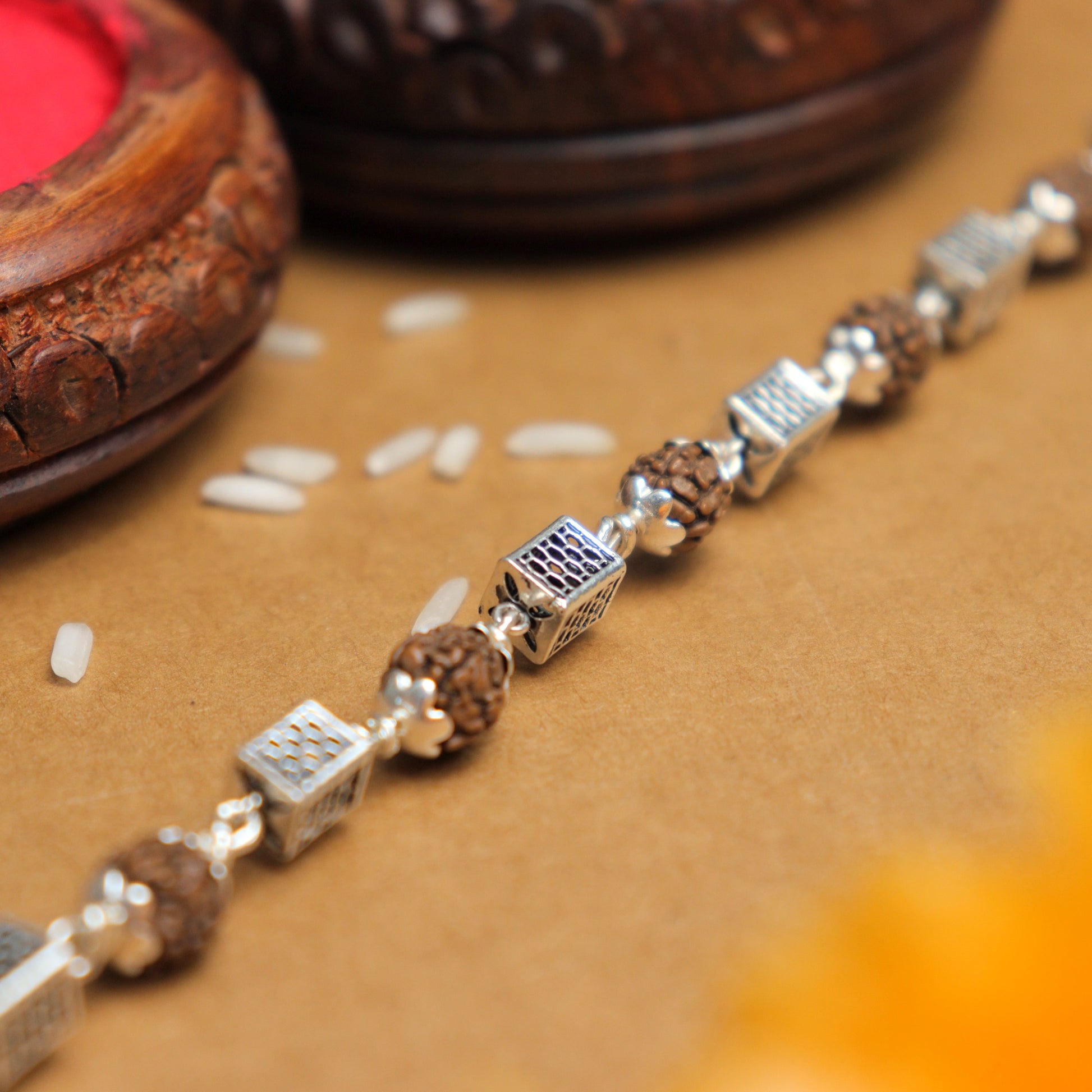Silver Rakhi with Square Cylinder Rudraksha Beads