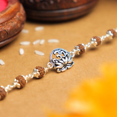 Silver Rakhi with Om and Lotus Flower and Single Line Rudraksha for Men