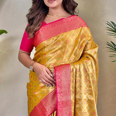 Staring Yellow Soft Banarasi Tissue Silk Saree With Ravishing Blouse Piece
