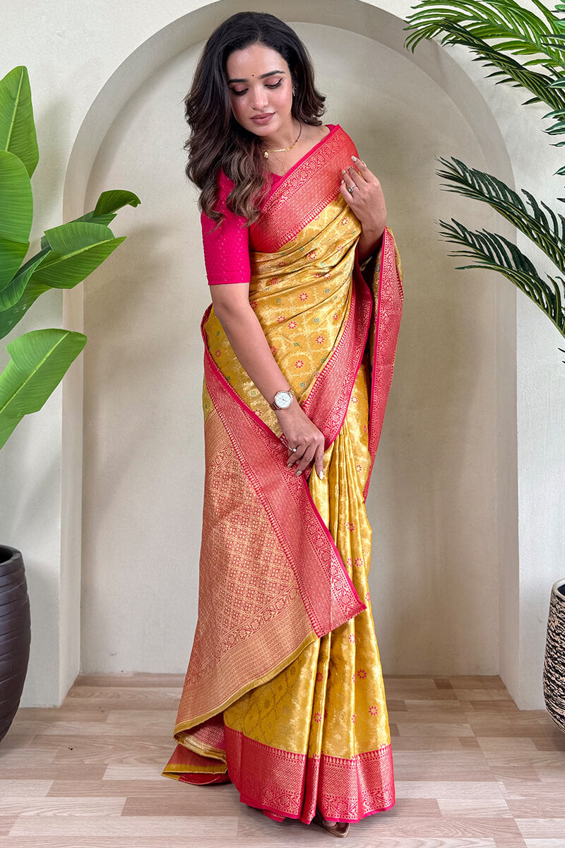 Staring Yellow Soft Banarasi Tissue Silk Saree With Ravishing Blouse Piece