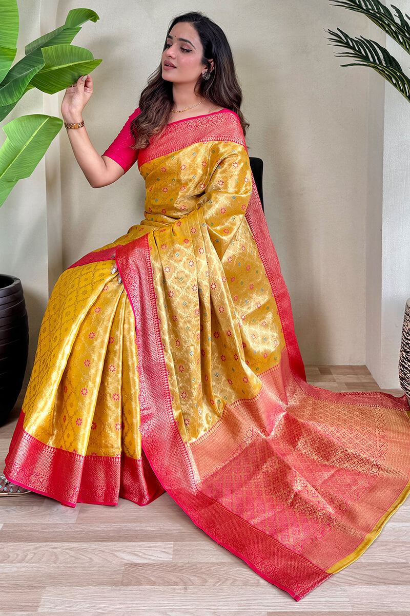 Staring Yellow Soft Banarasi Tissue Silk Saree With Ravishing Blouse Piece