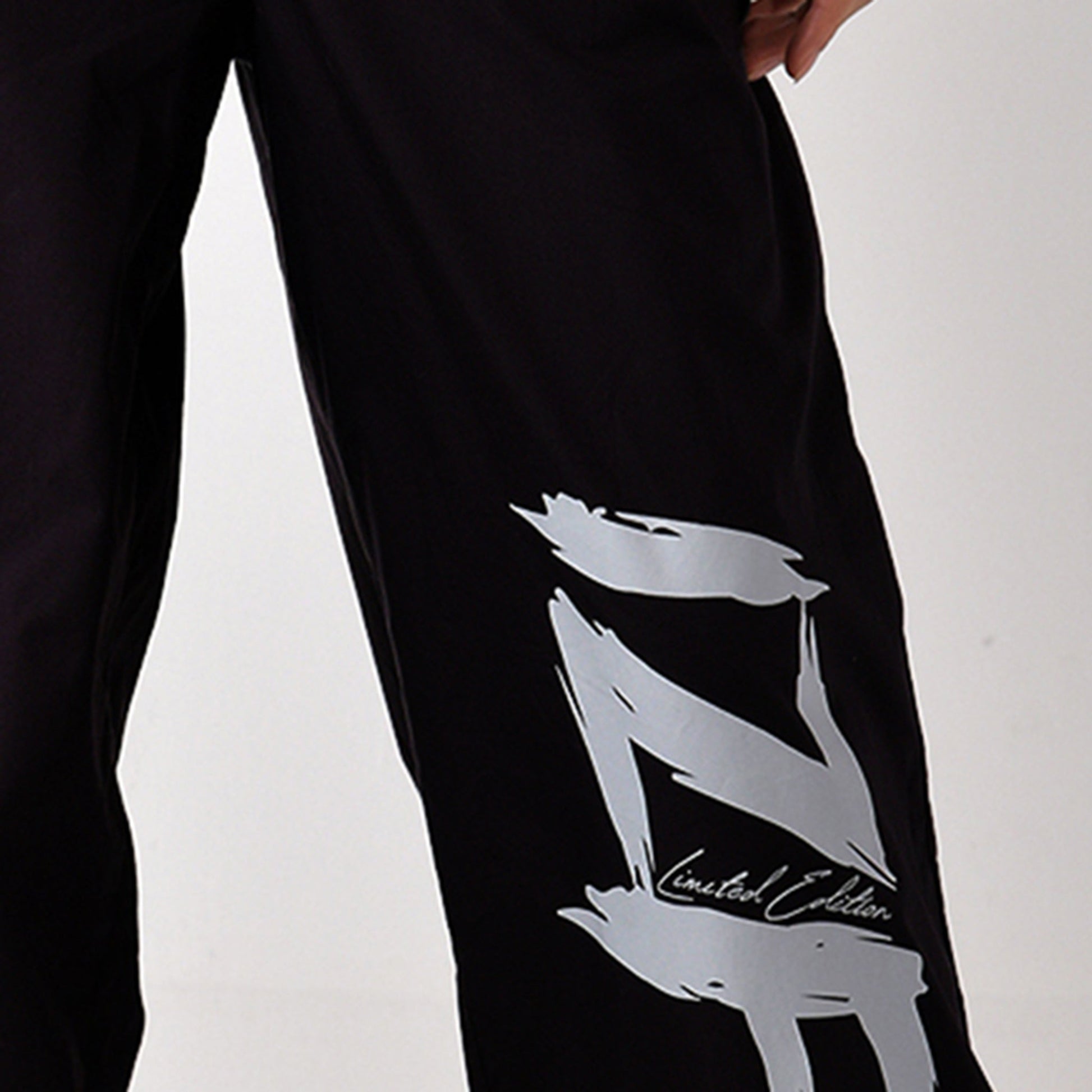 Printed "Limited edition" parachute pants for women in Black