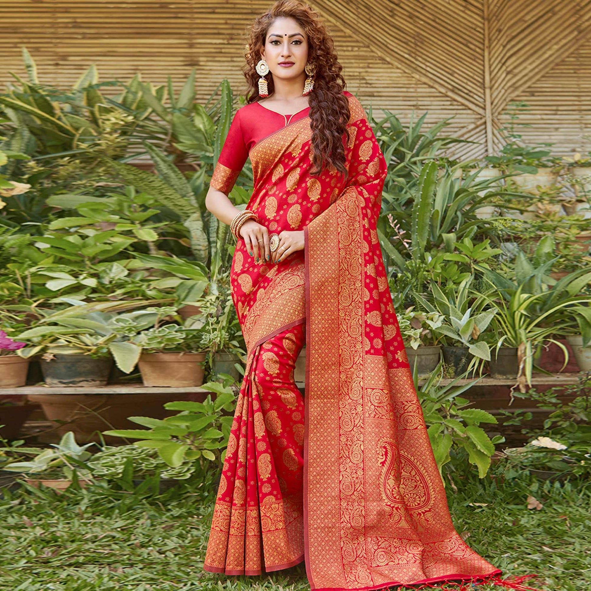 Breathtaking Red Colored Festive Wear Paisely Woven Silk Blend Saree With Tassels