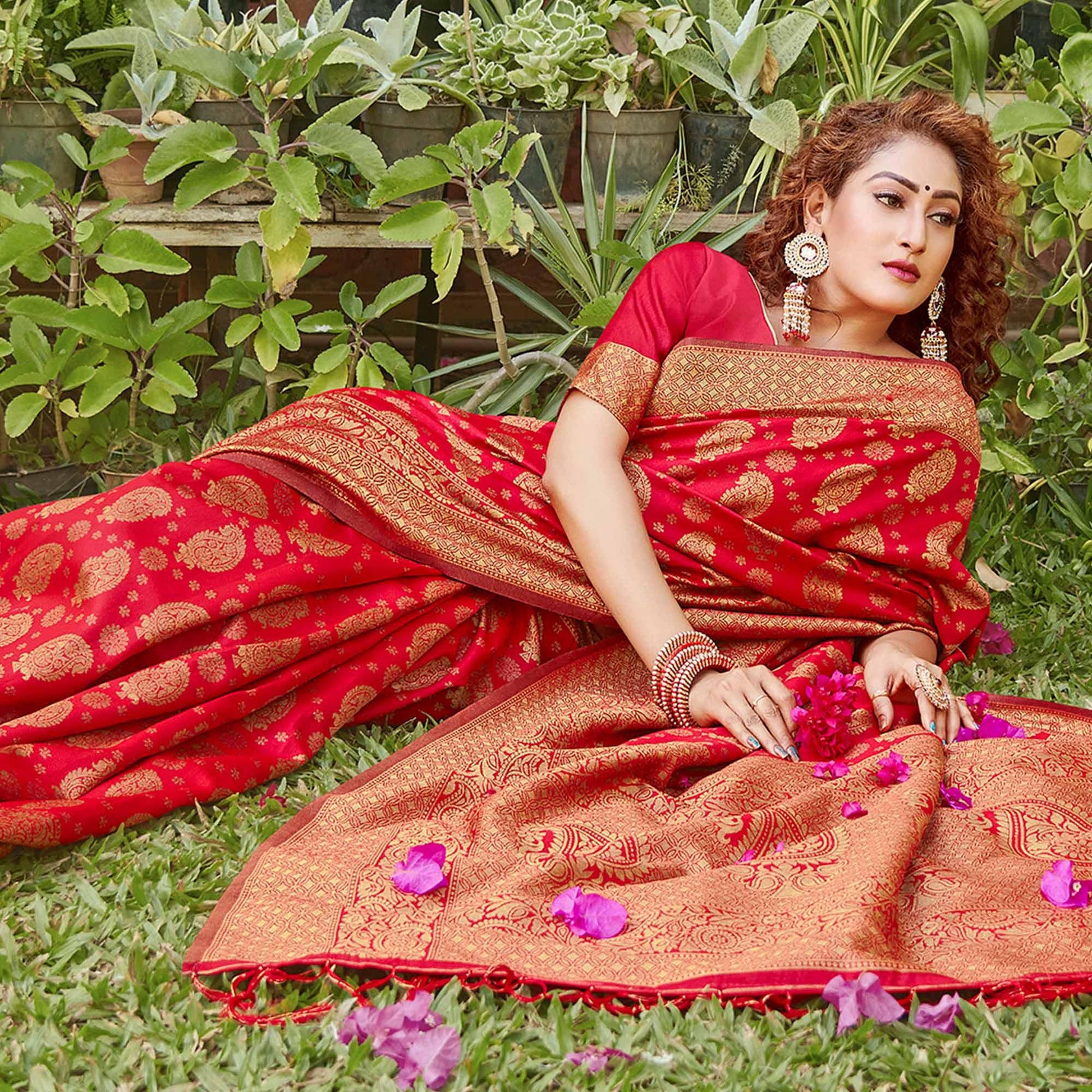 Breathtaking Red Colored Festive Wear Paisely Woven Silk Blend Saree With Tassels