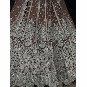 Brown Party Wear Heavy Embroidered Netted Lehenga Choli