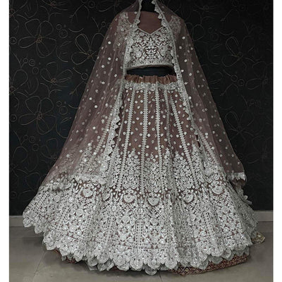 Brown Party Wear Heavy Embroidered Netted Lehenga Choli