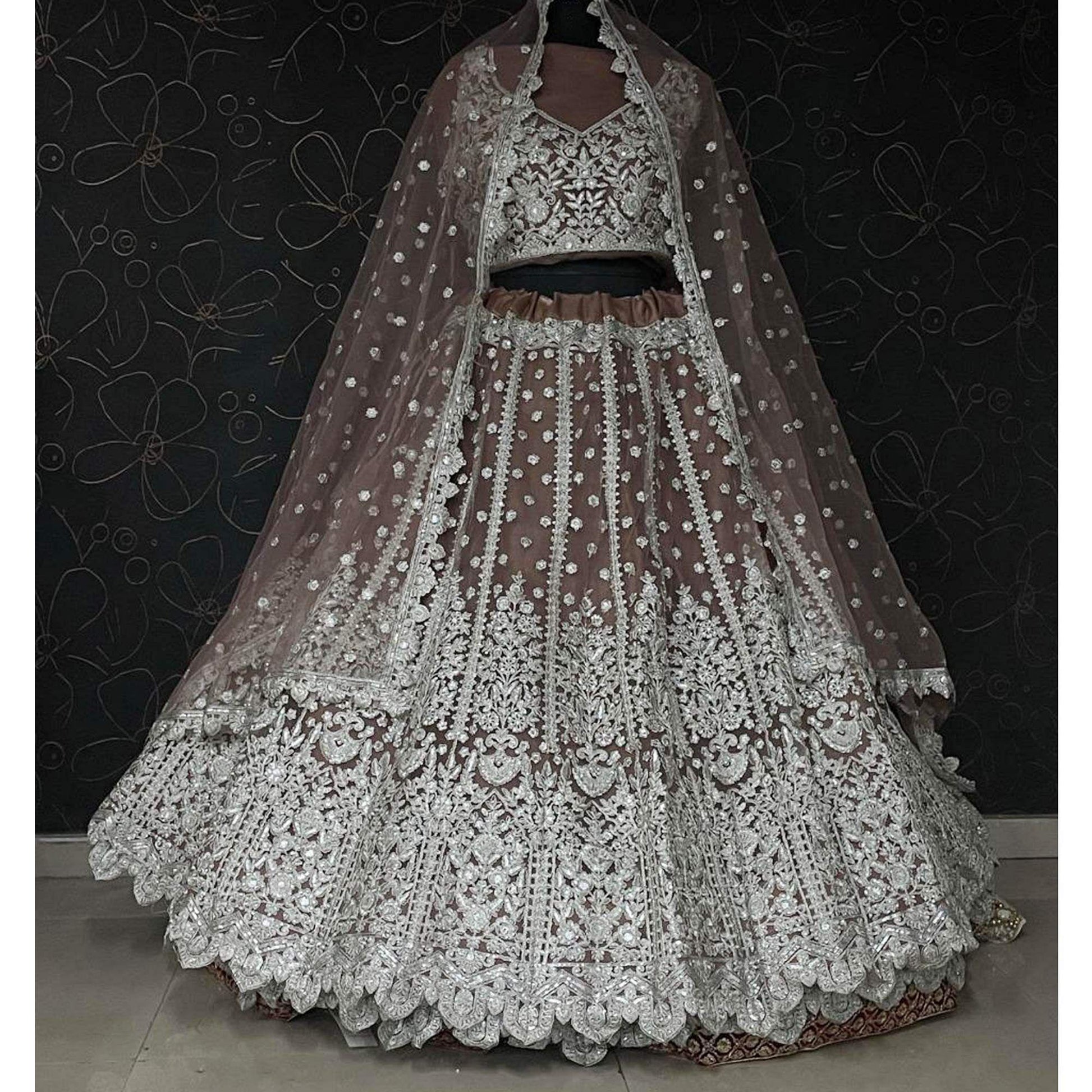 Brown Party Wear Heavy Embroidered Netted Lehenga Choli