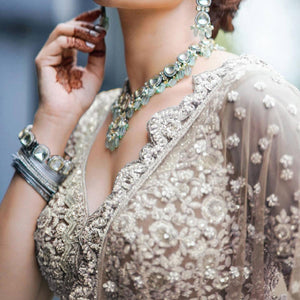 Brown Party Wear Heavy Embroidered Netted Lehenga Choli
