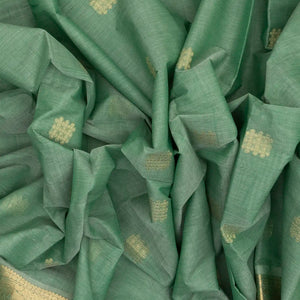 Light Green Handloom Kanchi Cotton Saree With Kolam Butta And Animal Motifs.