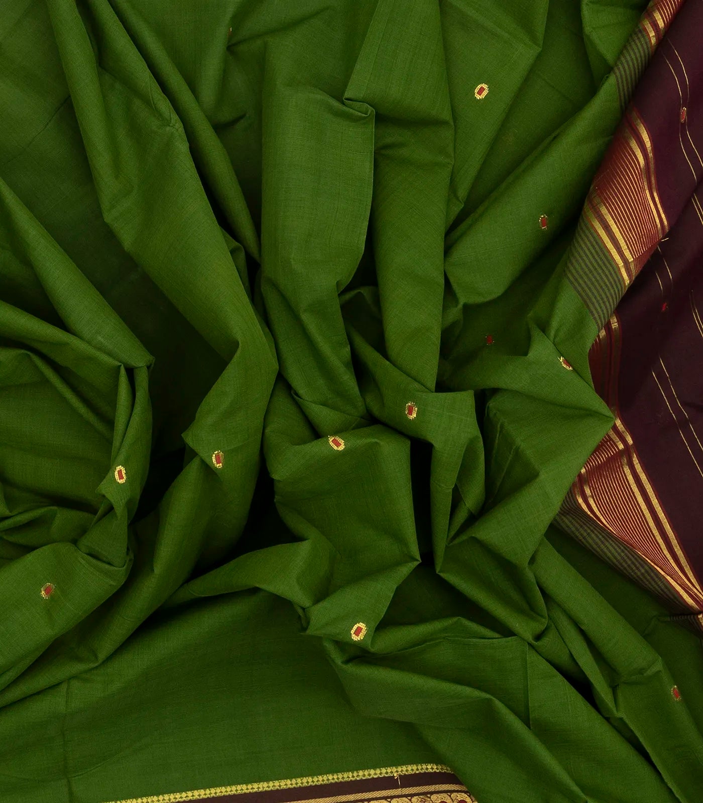 Green Handloom Kadapa cotton saree adorned with red Meenakari buttis