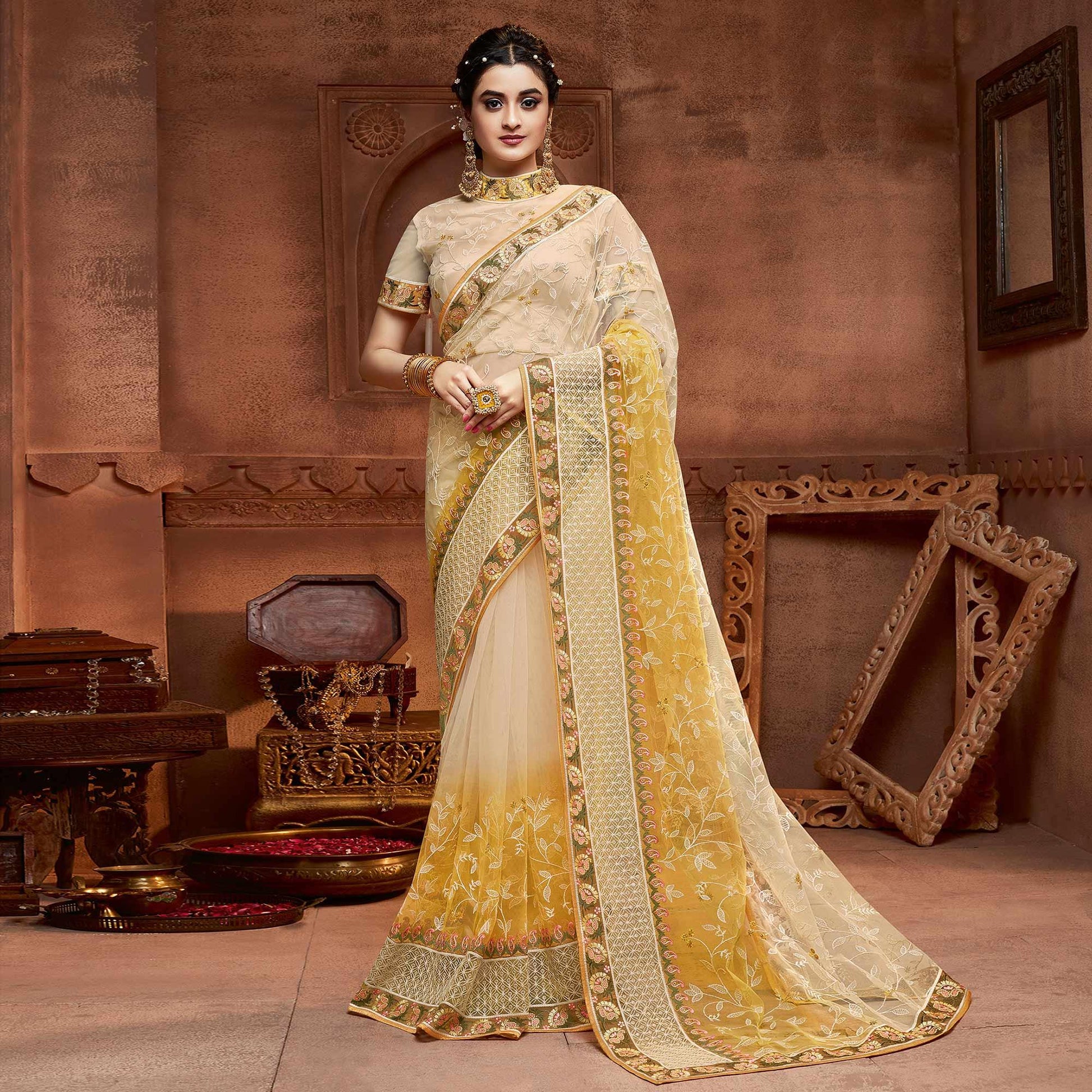 Capricious Beige & Mustard Coloured Partywear Embroidered Soft Net Saree