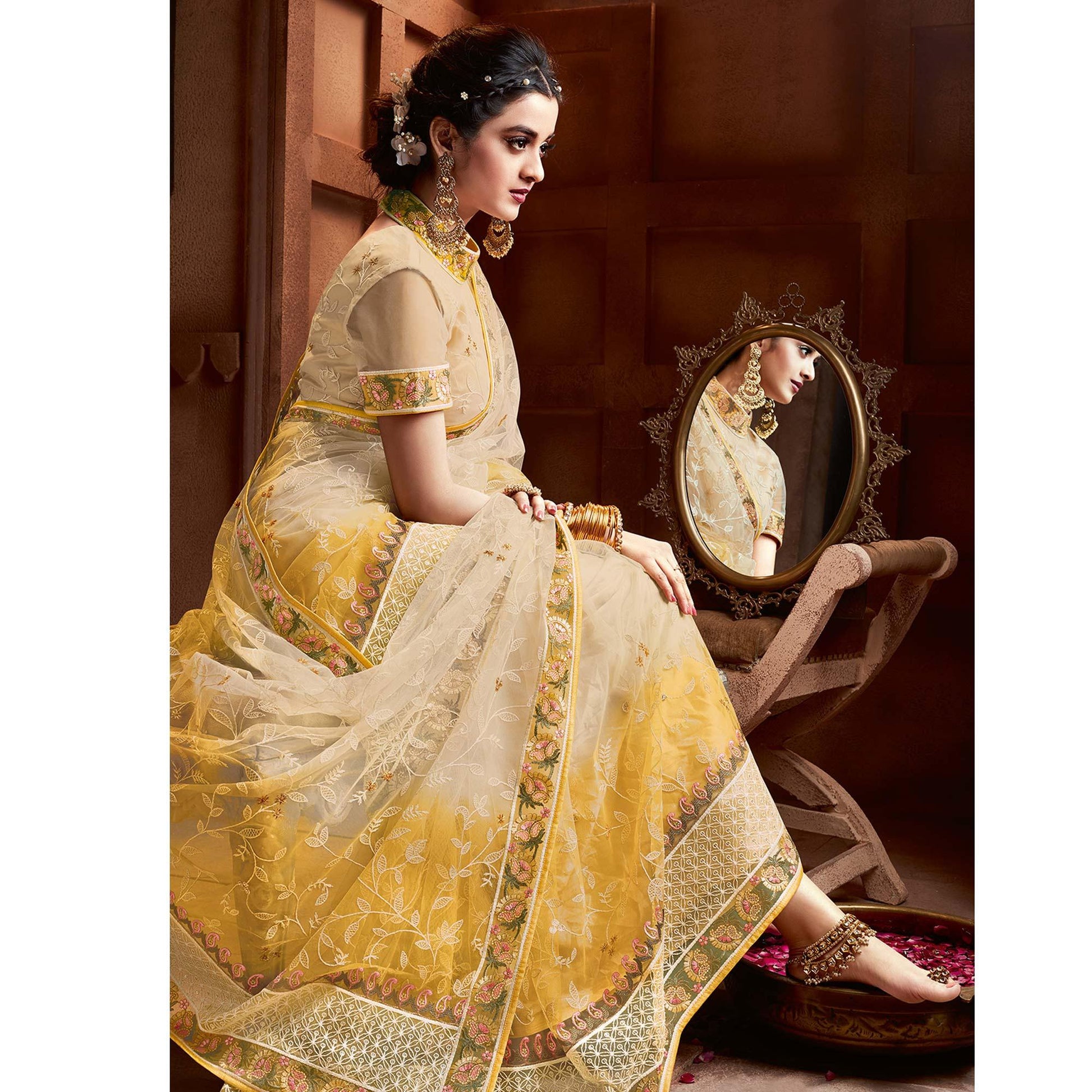 Capricious Beige & Mustard Coloured Partywear Embroidered Soft Net Saree