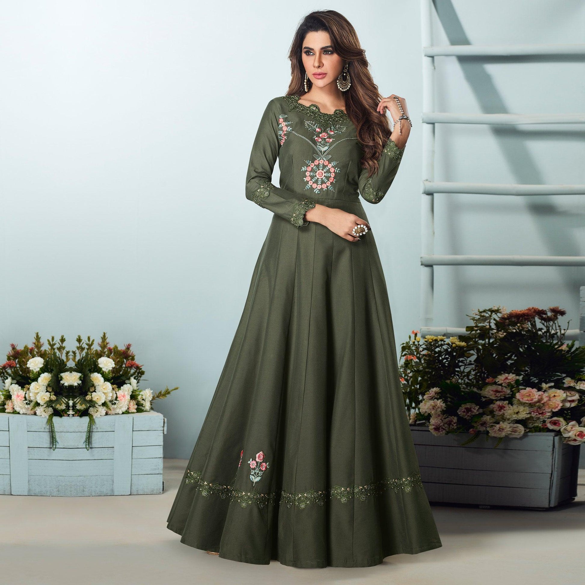 Capricious Dark Olive Green Colored Party Wear Embroidered Muslin Cotton Silk Gown