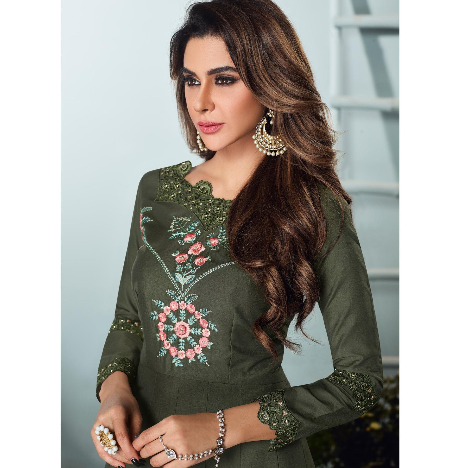 Capricious Dark Olive Green Colored Party Wear Embroidered Muslin Cotton Silk Gown