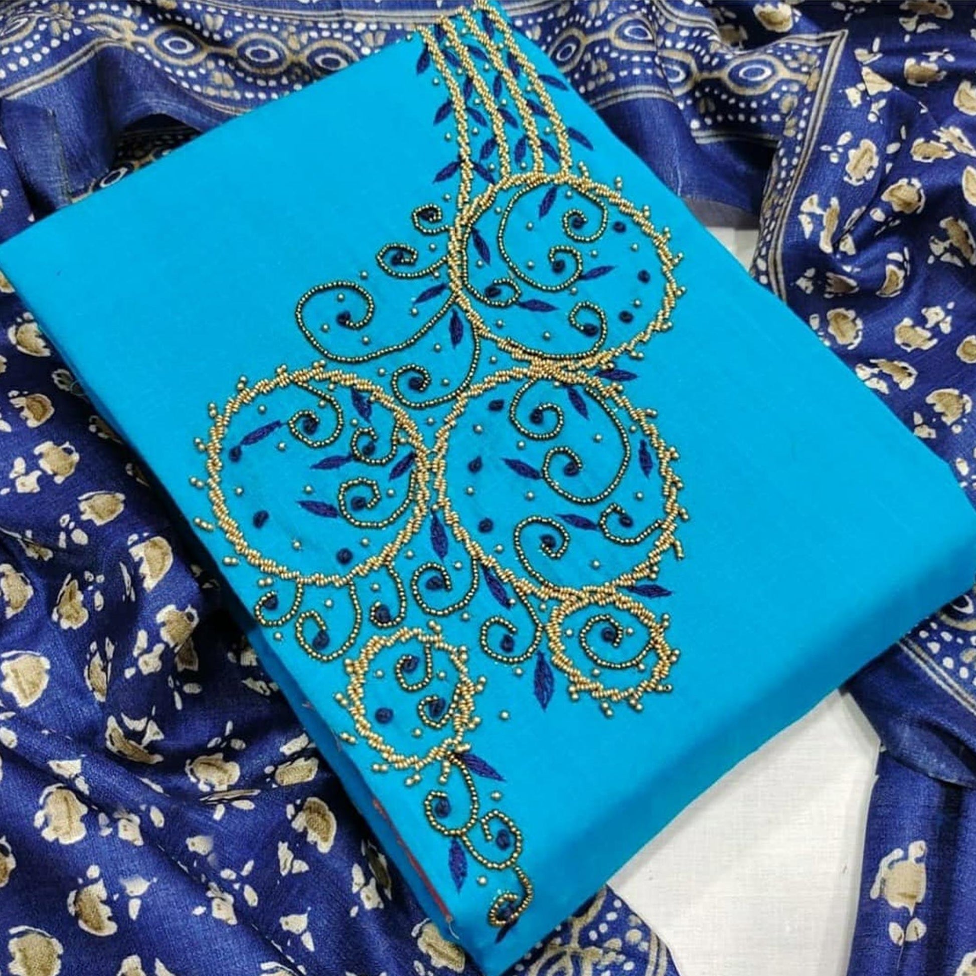 Capricious Firozi Colored Casual Wear Embroidered Modal Chanderi Dress Material