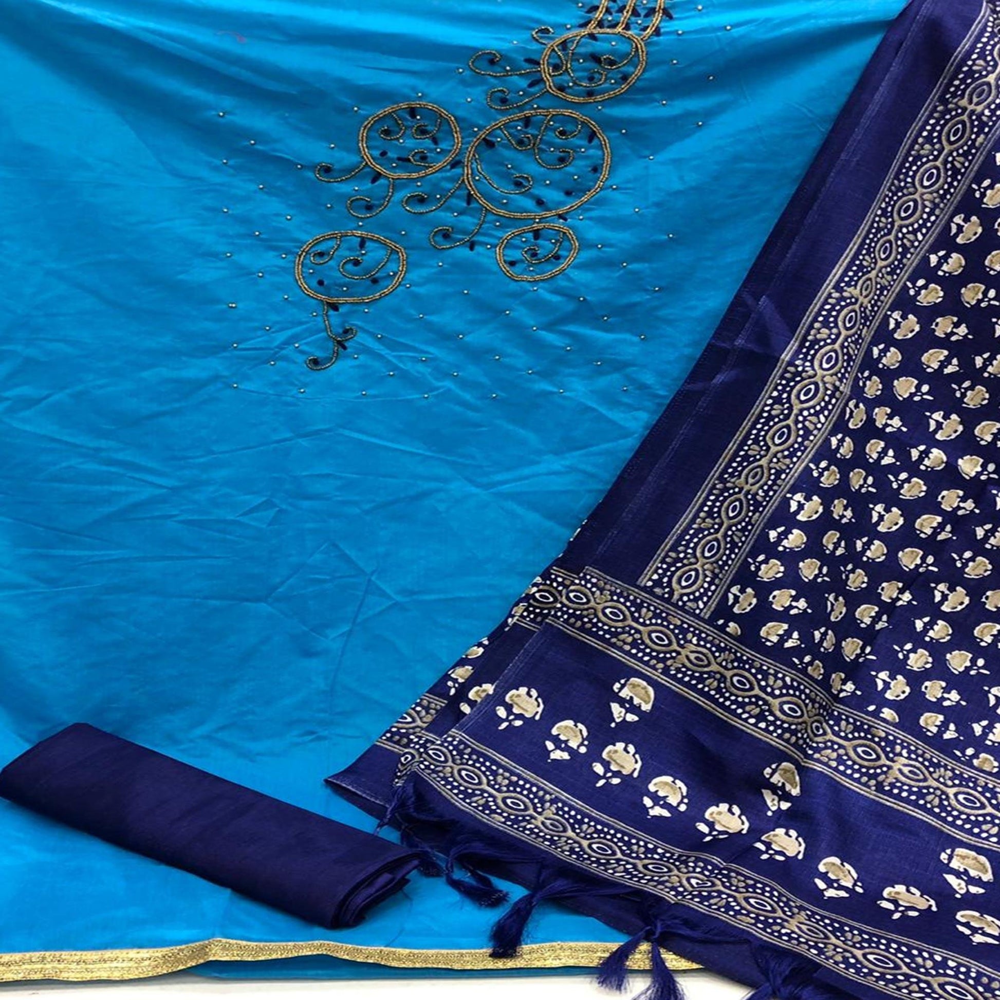Capricious Firozi Colored Casual Wear Embroidered Modal Chanderi Dress Material
