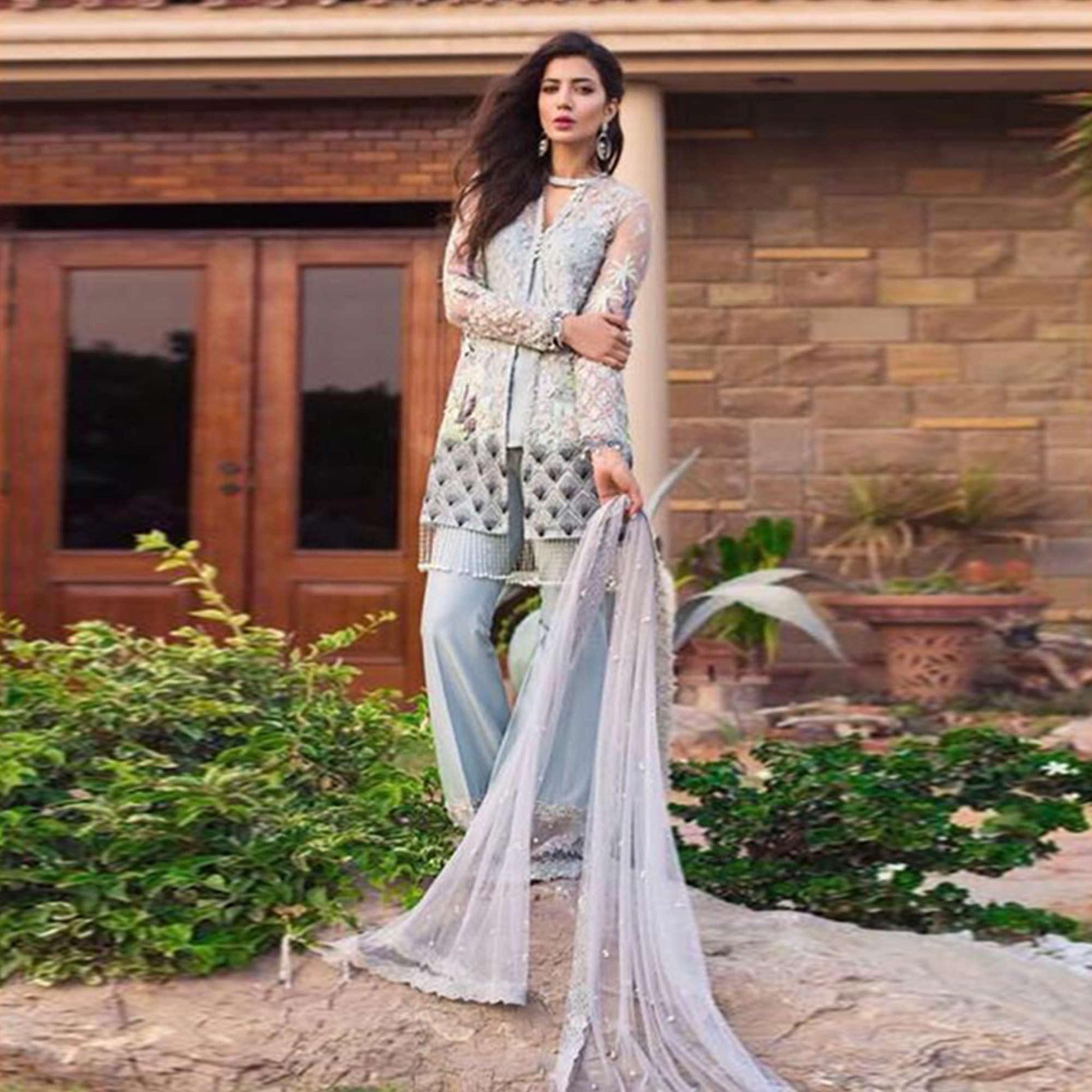 Capricious Light Blue Colored Partywear Embroidered Netted Palazzo Suit