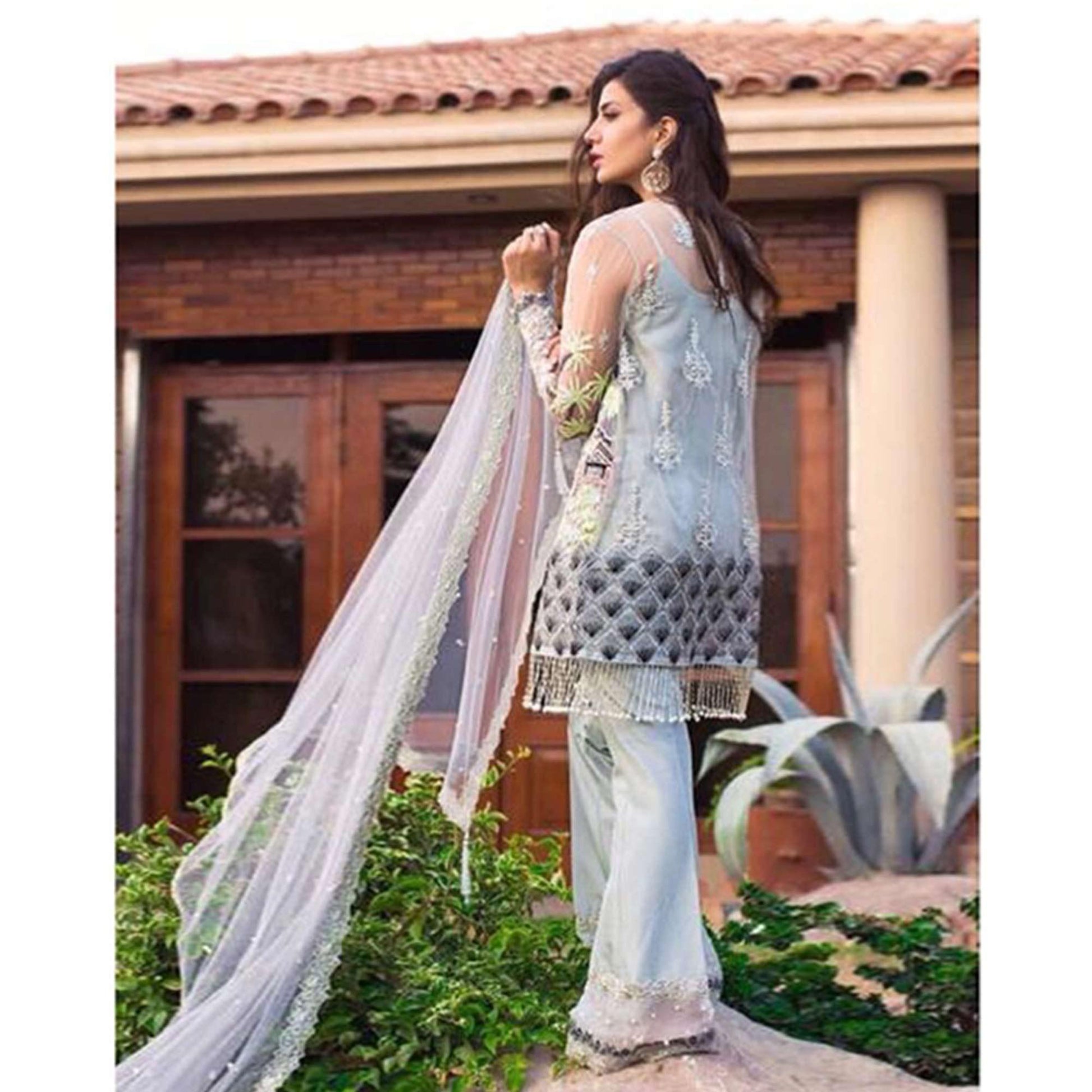Capricious Light Blue Colored Partywear Embroidered Netted Palazzo Suit