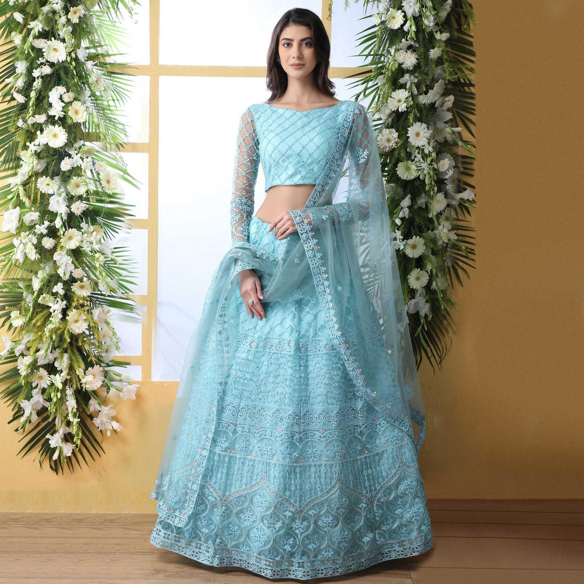 Capricious Sky Blue Colored Partywear Embroidered Netted Lehenga Choli