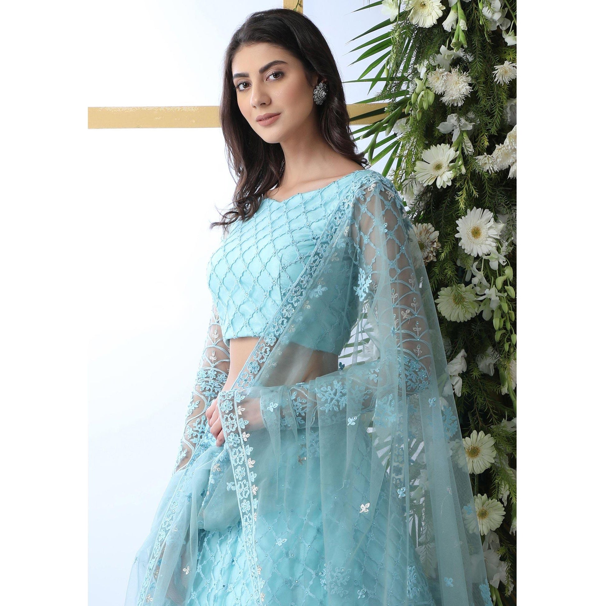 Capricious Sky Blue Colored Partywear Embroidered Netted Lehenga Choli