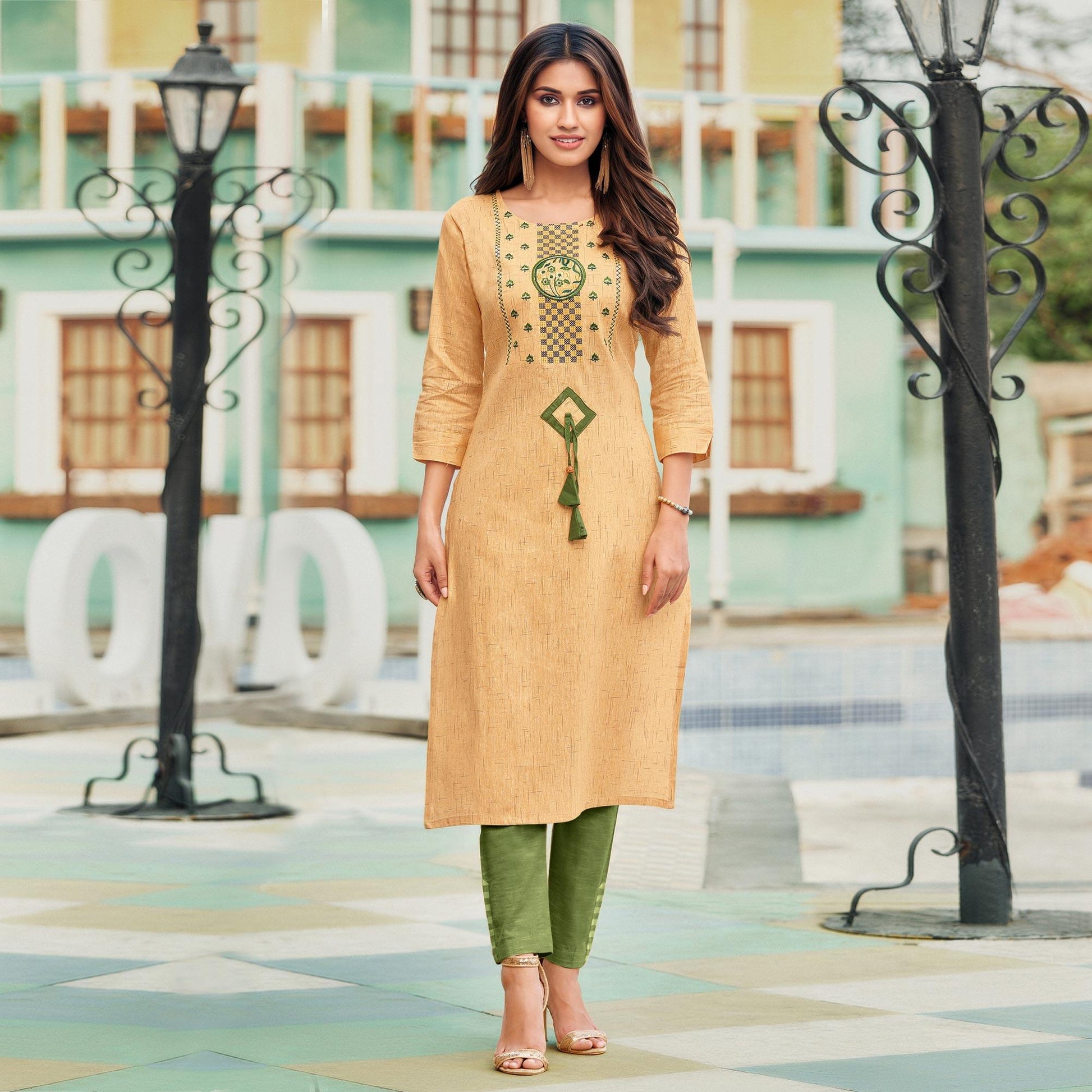 Capricious Yellowish Beige Colored Casual Wear Embroidered Heavy Pure Cotton Kurti