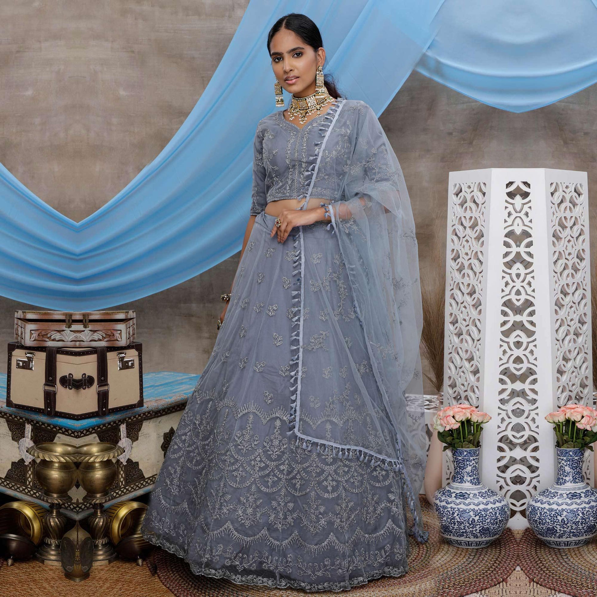 Captivating Grey Colored Party Wear Heavy Embroidered Net Lehenga Choli