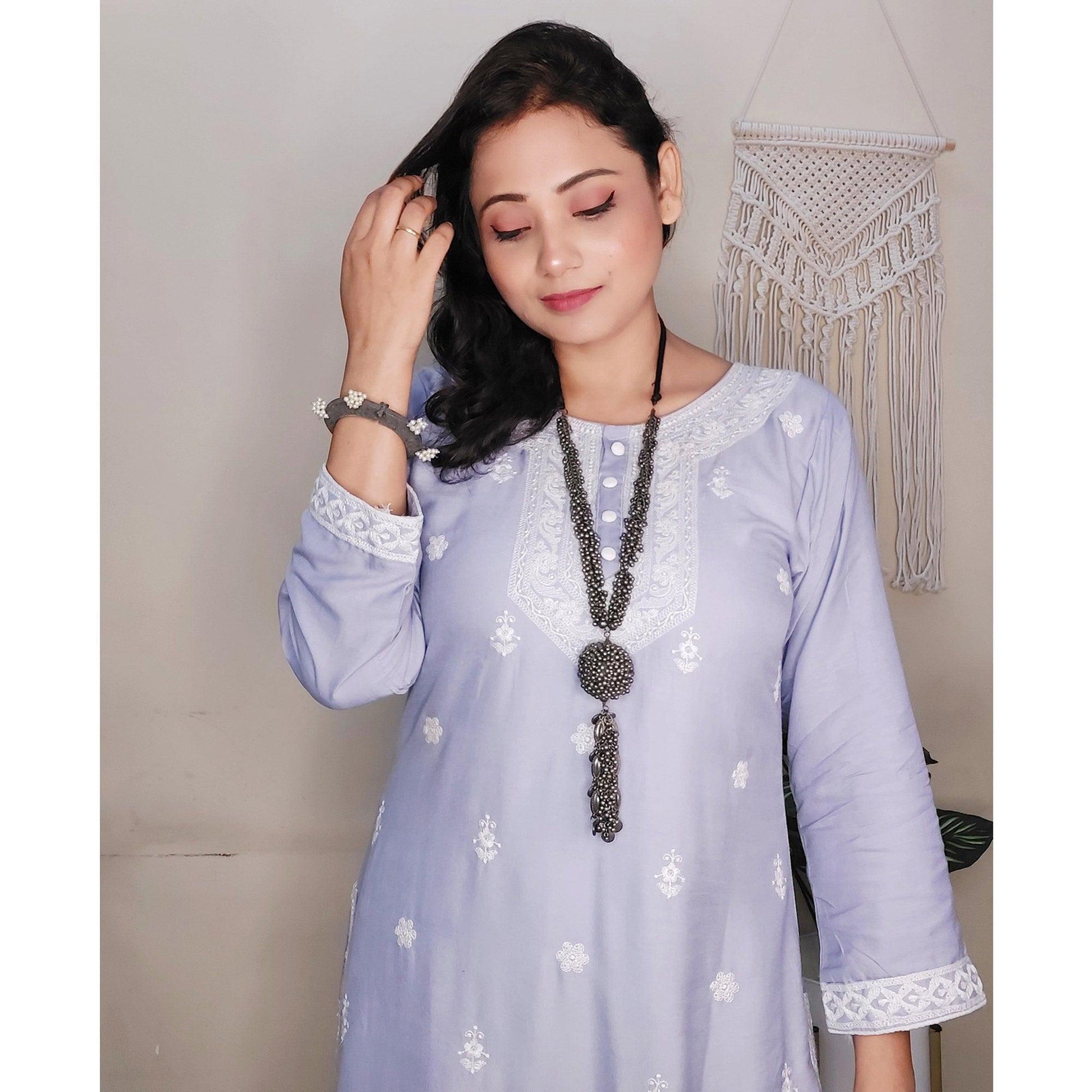 Captivating Lavendar Colored Casual Wear Embroidered Pure Rayon Viscose Kurti