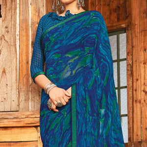 Captivating Rama & Blue Coloured Partywear Pure Georgette Floral Printed Saree With Fancy Lace Border