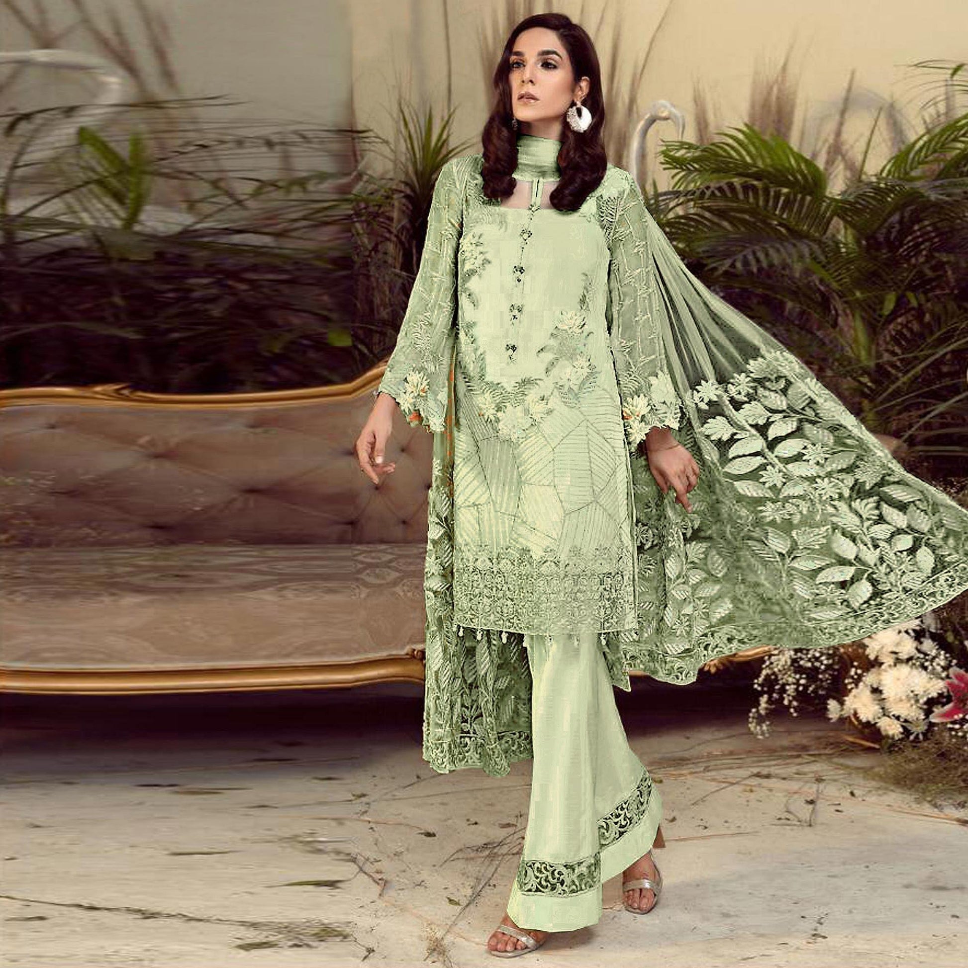 Charming Green Colored Partywear Embroidered Faux Gerogette Straight Suit